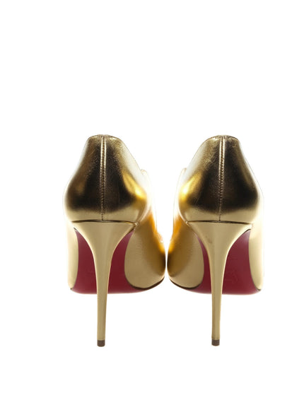 a pair of gold and red high heels