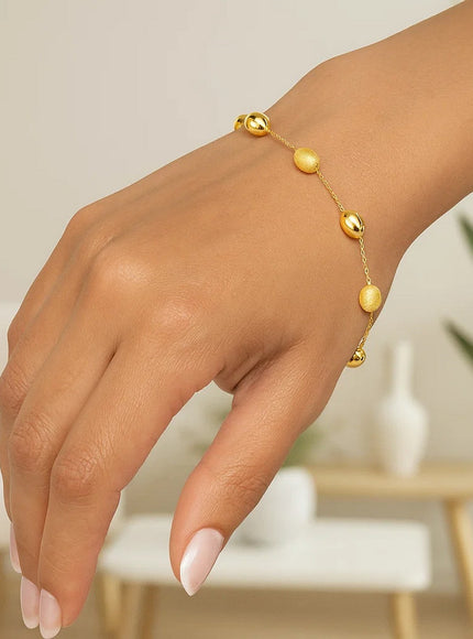 14k Yellow Gold Bracelet with Textured and Polished Pebble Stations