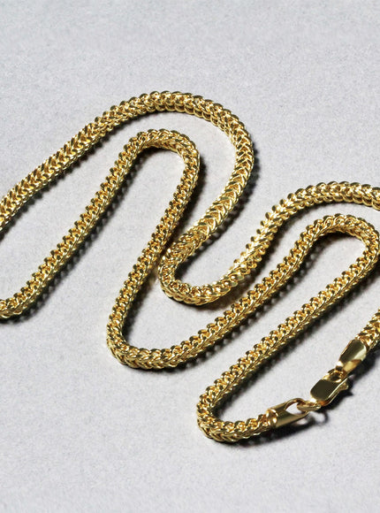 14k yellow gold wheat chain laid out