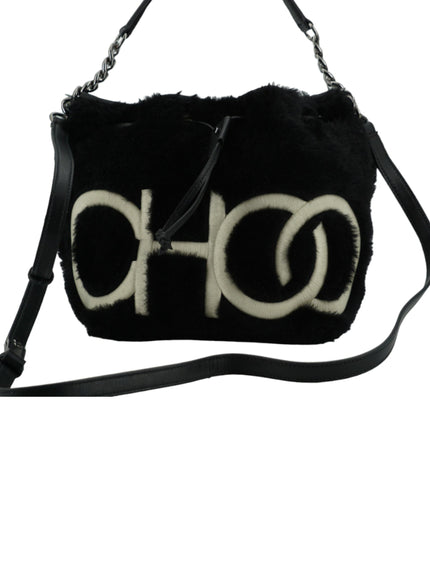 a black and white purse with a logo on it