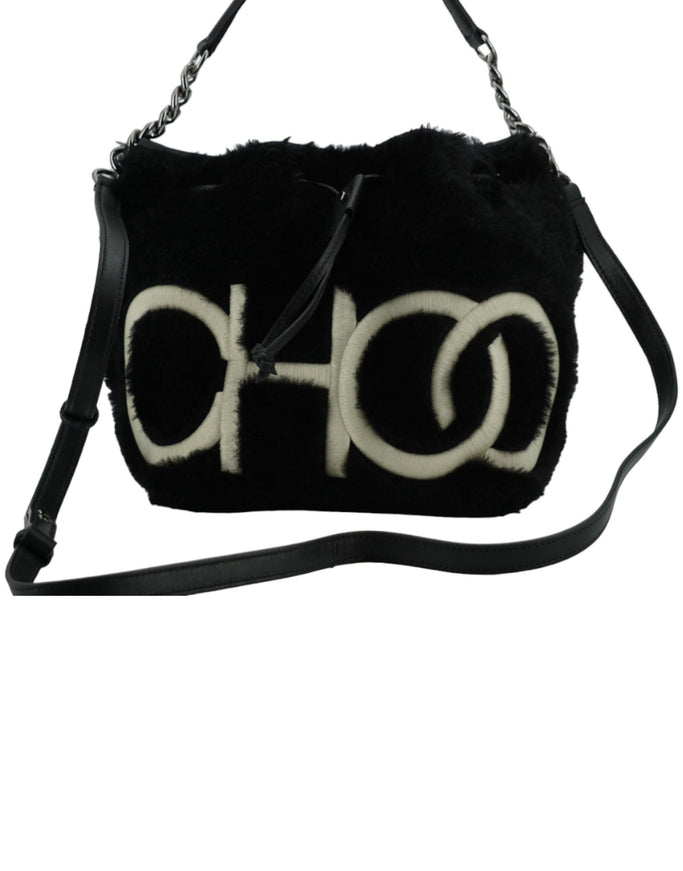 a black and white purse with a logo on it