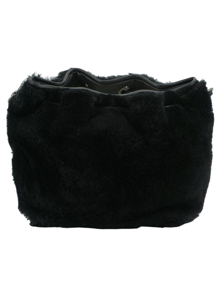 a black purse with a bow on it