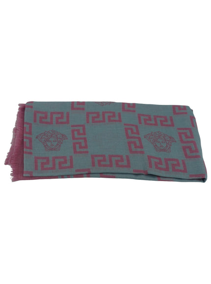 a blue and pink scarf with a lion on it