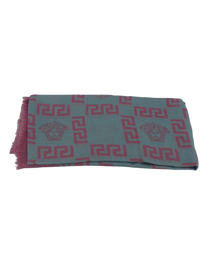 a blue and pink scarf with a lion on it