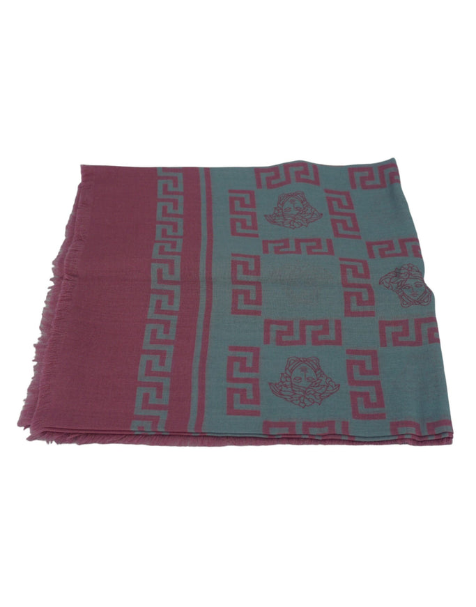 a pink and blue scarf with a design on it