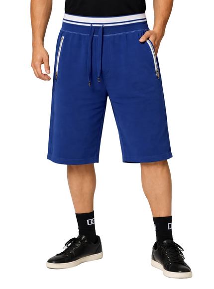 Person wearing dolce & gabbana blue shorts with white drawstring and trim on a white background
