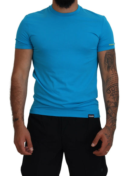 a man wearing a blue shirt and black shorts