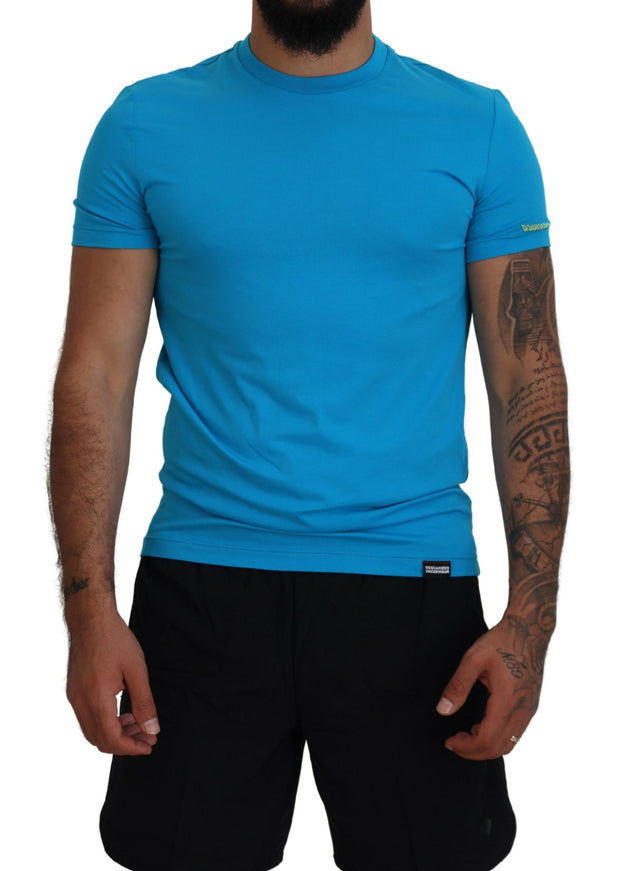 a man wearing a blue shirt and black shorts