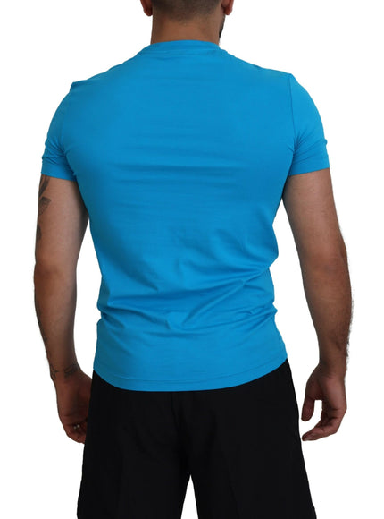 a man wearing a blue shirt and black shorts