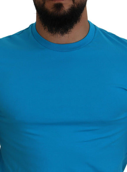 a man with a beard wearing a blue shirt