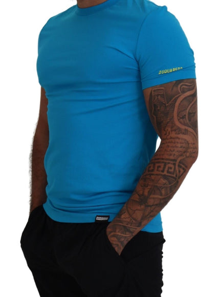 a man wearing a blue shirt and black shorts