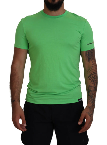 a man wearing a green shirt and black shorts