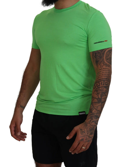 a man wearing a green shirt and black shorts