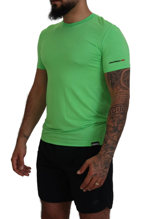 a man wearing a green shirt and black shorts