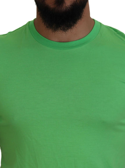 a man with a beard wearing a green shirt