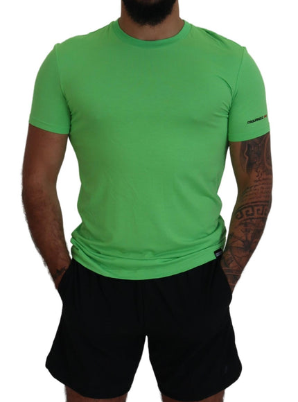 a man wearing a green shirt and black shorts