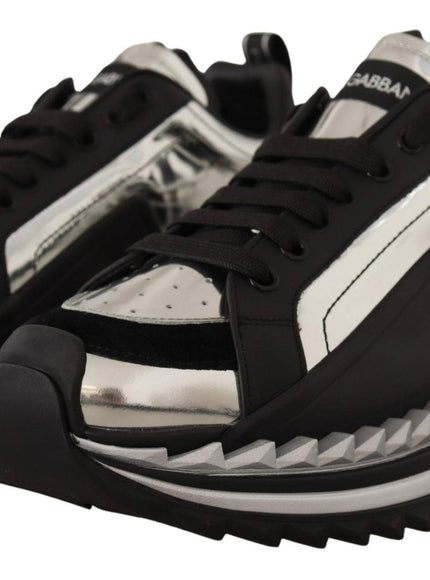 a pair of black and white sneakers on top of each other