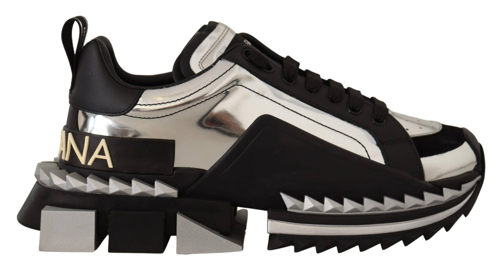 a pair of black and white sneakers with spikes