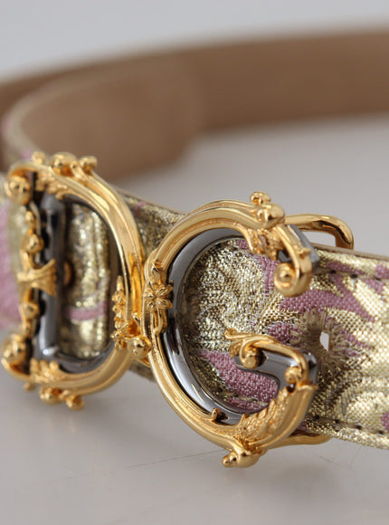 a close up of a gold and pink dog collar