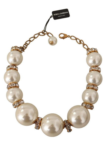 a bracelet with pearls and diamonds on a white background