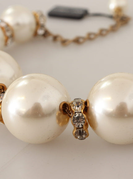 a close up of a bracelet with pearls