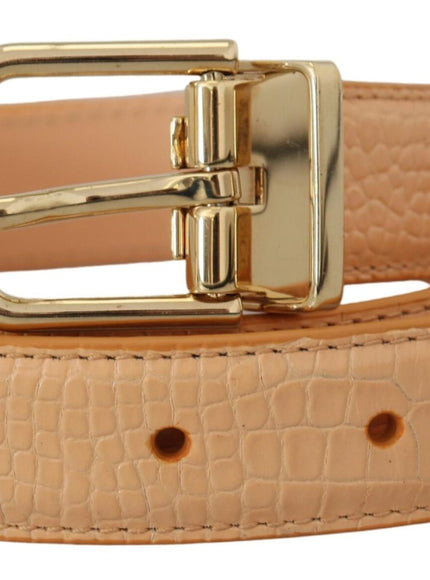 a tan belt with a gold buckle