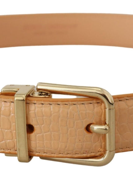 a tan belt with a gold buckle