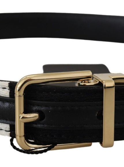 a black and white belt with a gold buckle