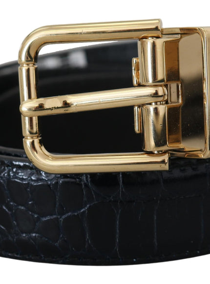 a black leather belt with a gold buckle