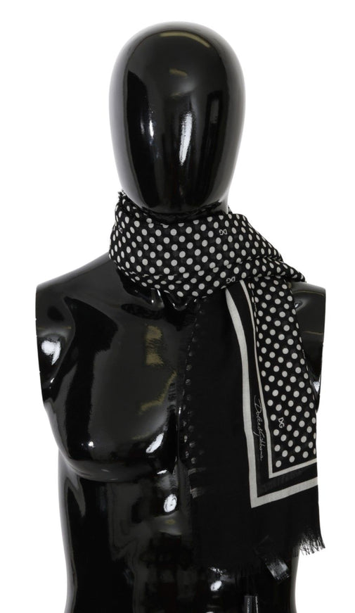 a mannequin wearing a black and white scarf