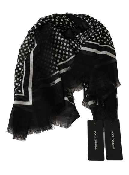 a black and white scarf with a tag on it