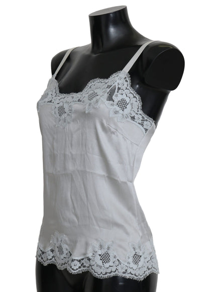 a mannequin wearing a white top with white lace