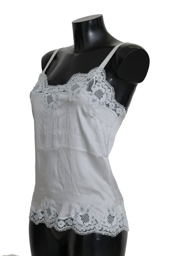 a mannequin wearing a white top with white lace