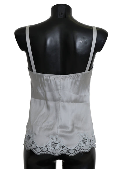 a mannequin wearing a white top with lace trim