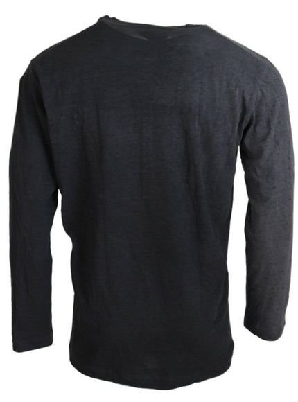 the back of a black long sleeved shirt