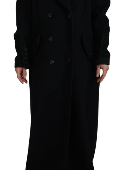 a woman wearing a black coat and hat