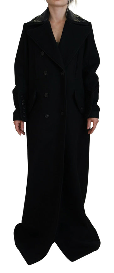 a woman wearing a black coat and hat