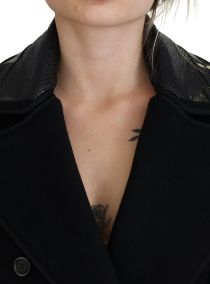 a woman in a black coat with a tattoo on her chest