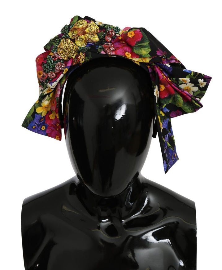 a black mannequin head with a multicolored floral print on it