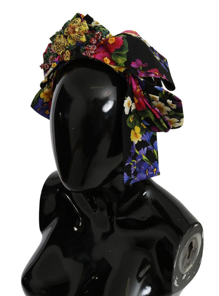 a black mannequin with a flowered hat on top of it