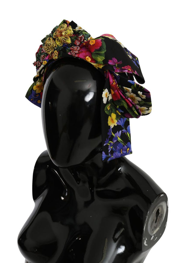 a black mannequin with a flowered hat on top of it