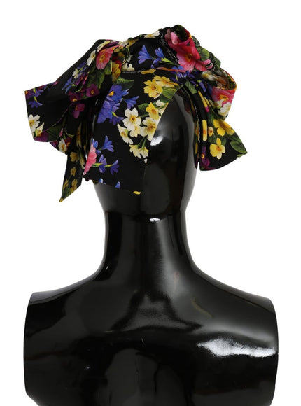 a black mannequin head with a floral print on it