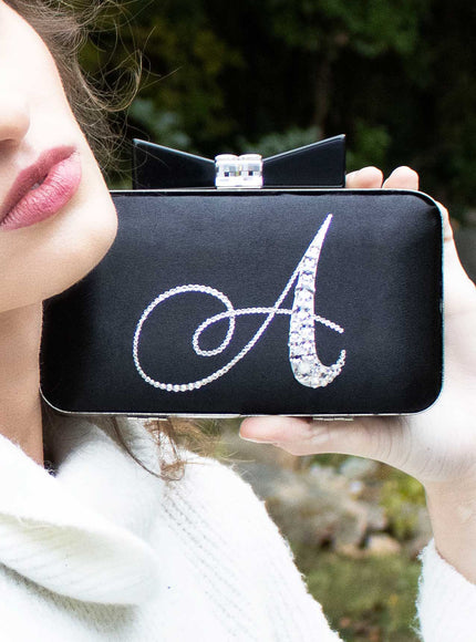 Joy Crystal Initial Bow Clutch