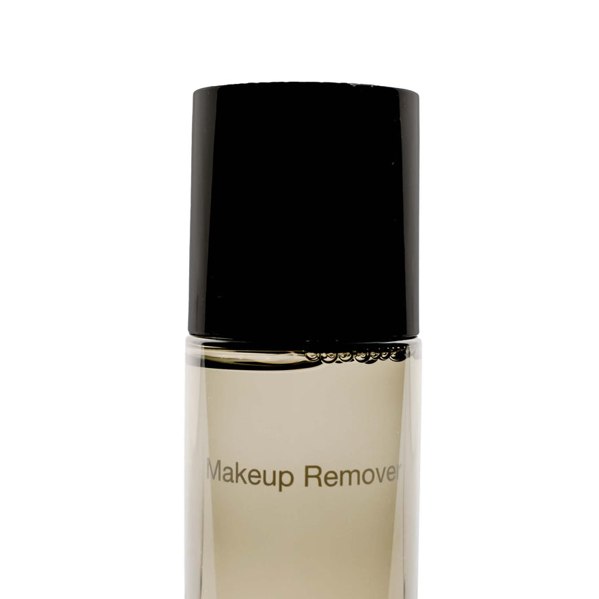 a bottle of makeup remover on a white background