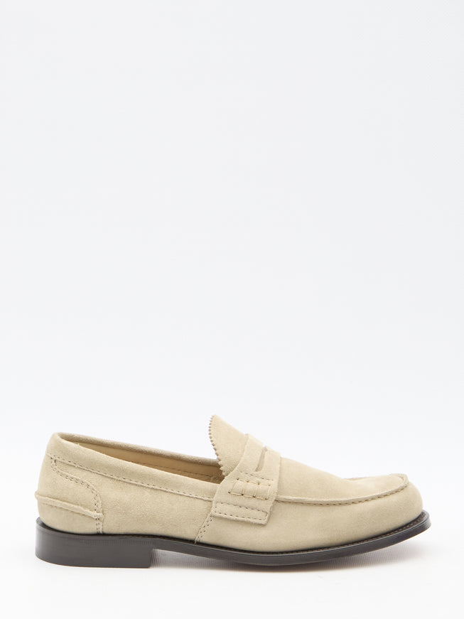 a white loafer with a black rubber sole