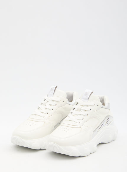 a pair of white sneakers on a white background