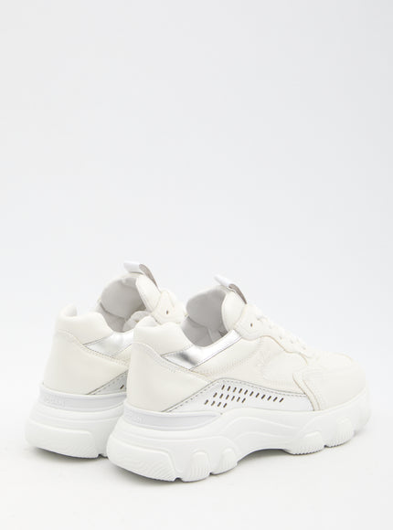 a pair of white sneakers with a white sole