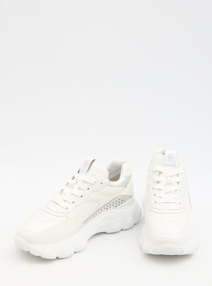 a pair of white sneakers on a white background