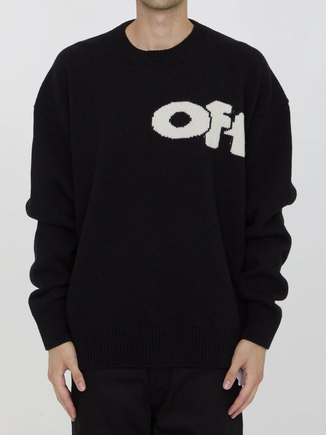 a man wearing a black sweater with the word off on it