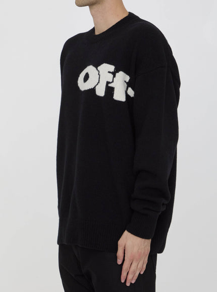 a man wearing a black sweater with the word off on it